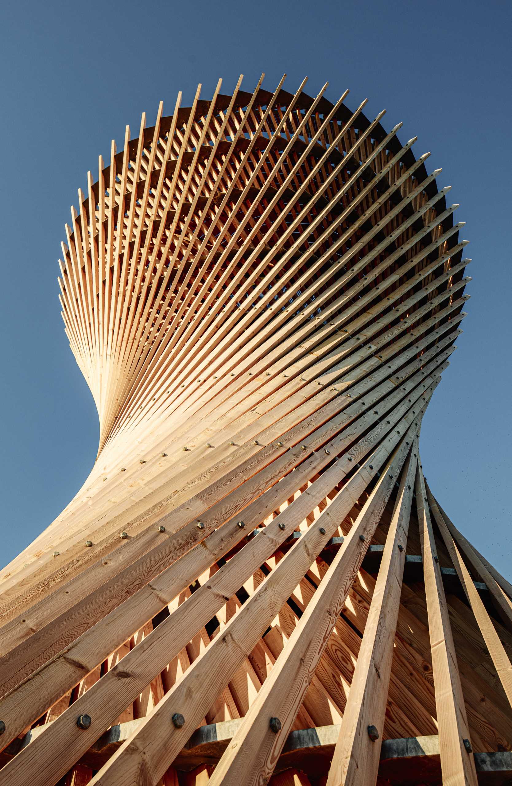 An observation tower in Sweden that looks like twisted wood.