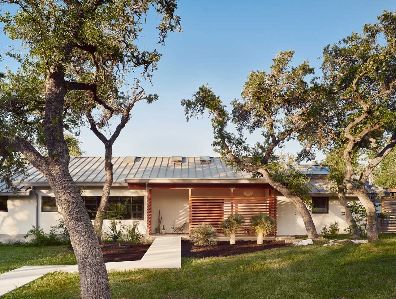 A renovated home with a small front porch.