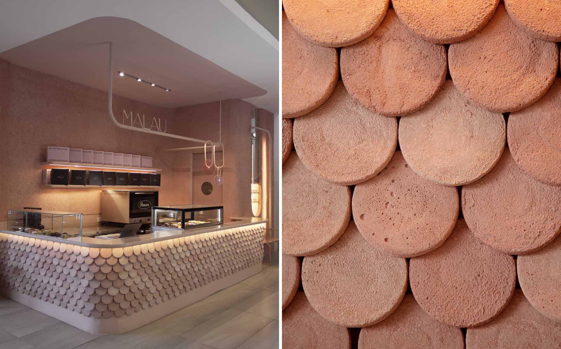 A modern bakery with a pastel pink colour palette, also includes handcrafted pieces of dyed cement that make up the cladding of the bar front.