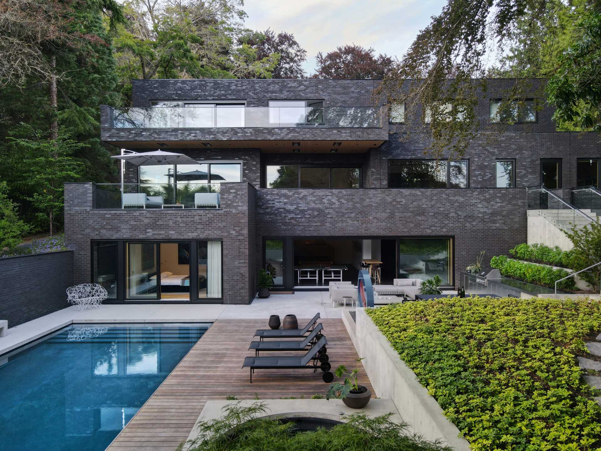 A modern house with a dark brick exterior.