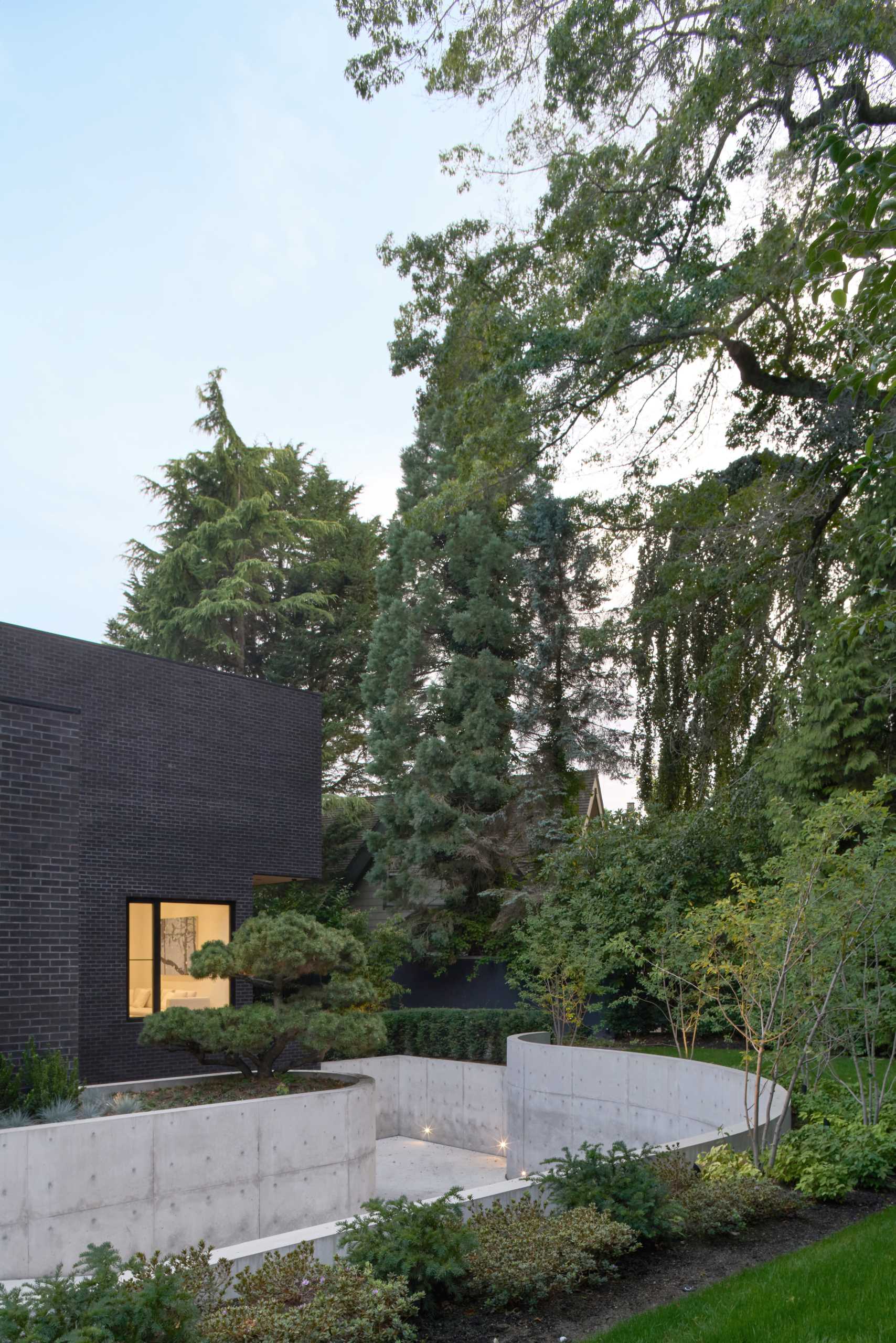 A modern house with a dark brick exterior.