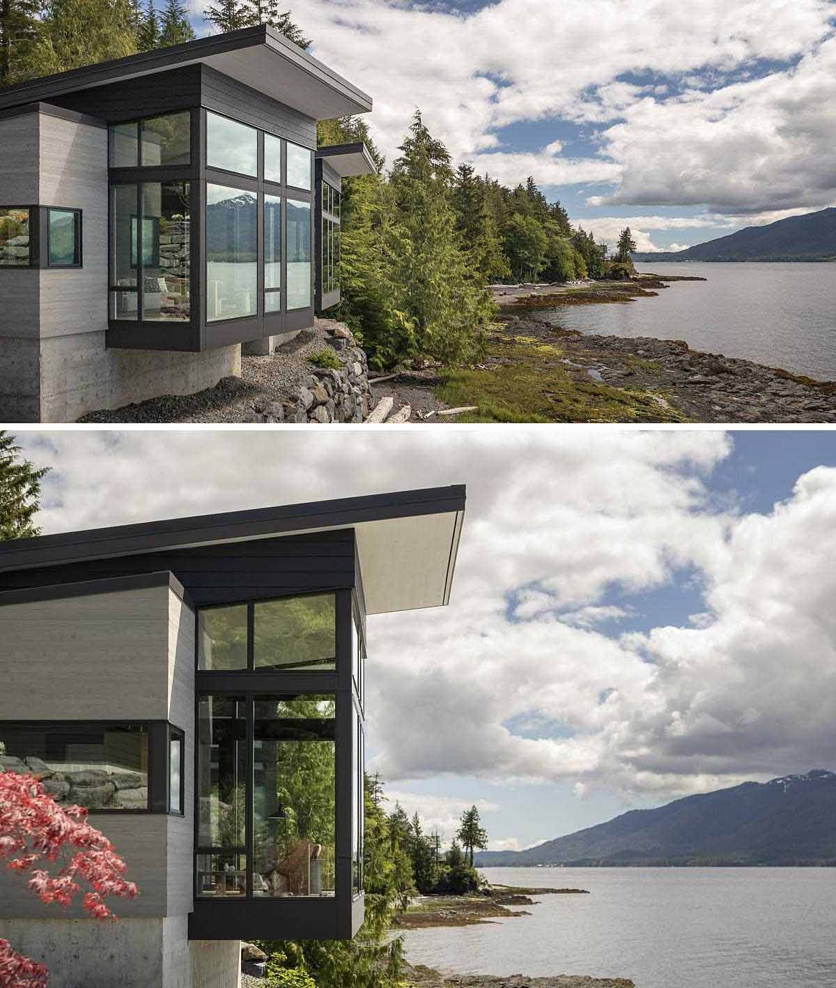 A modern home design has the primary bedroom and living room extend as cantilevers over the rock wall below, giving a sense of floating above the water.