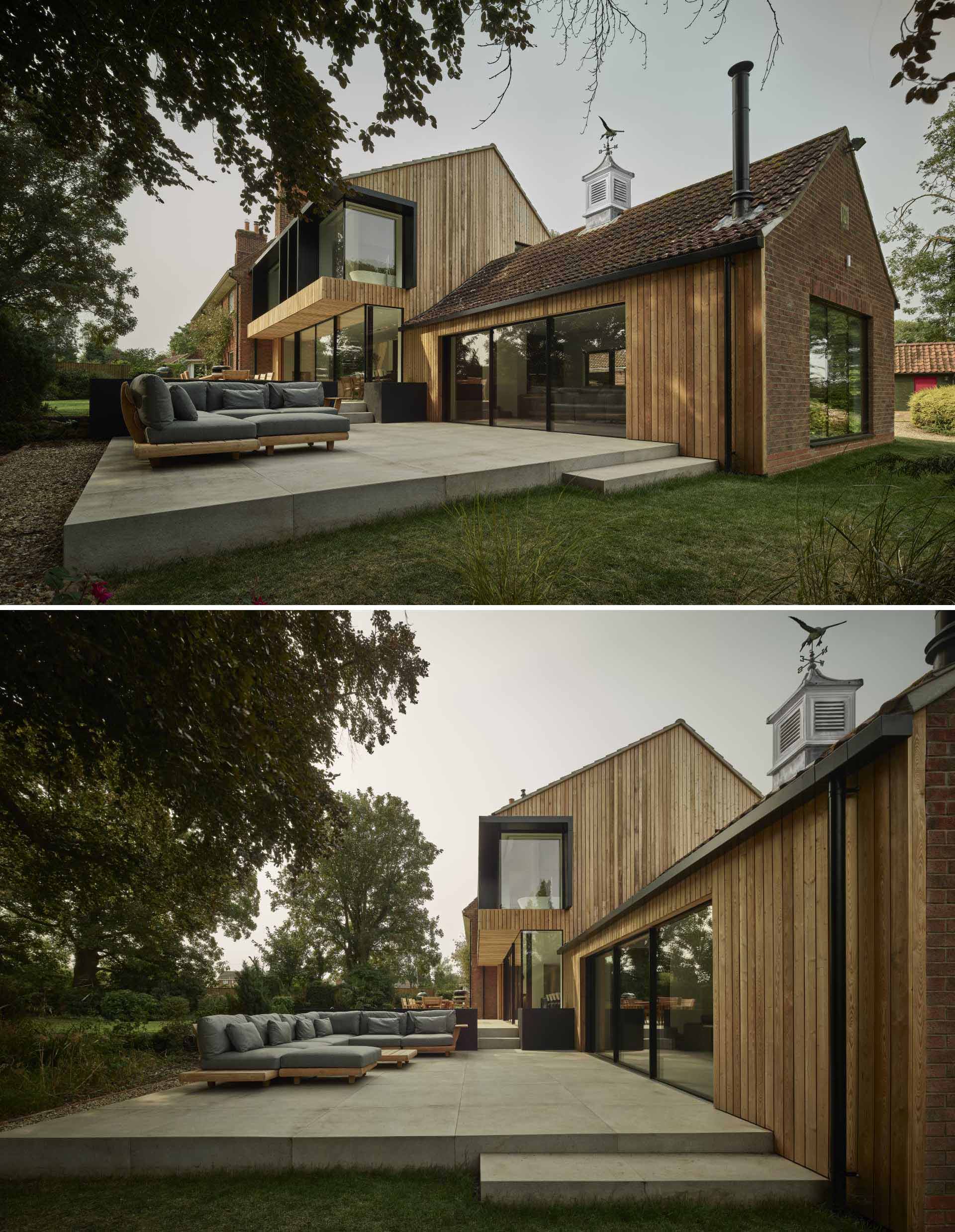 An old brick home received a new wood-clad two-storey extension with a contemporary interior.