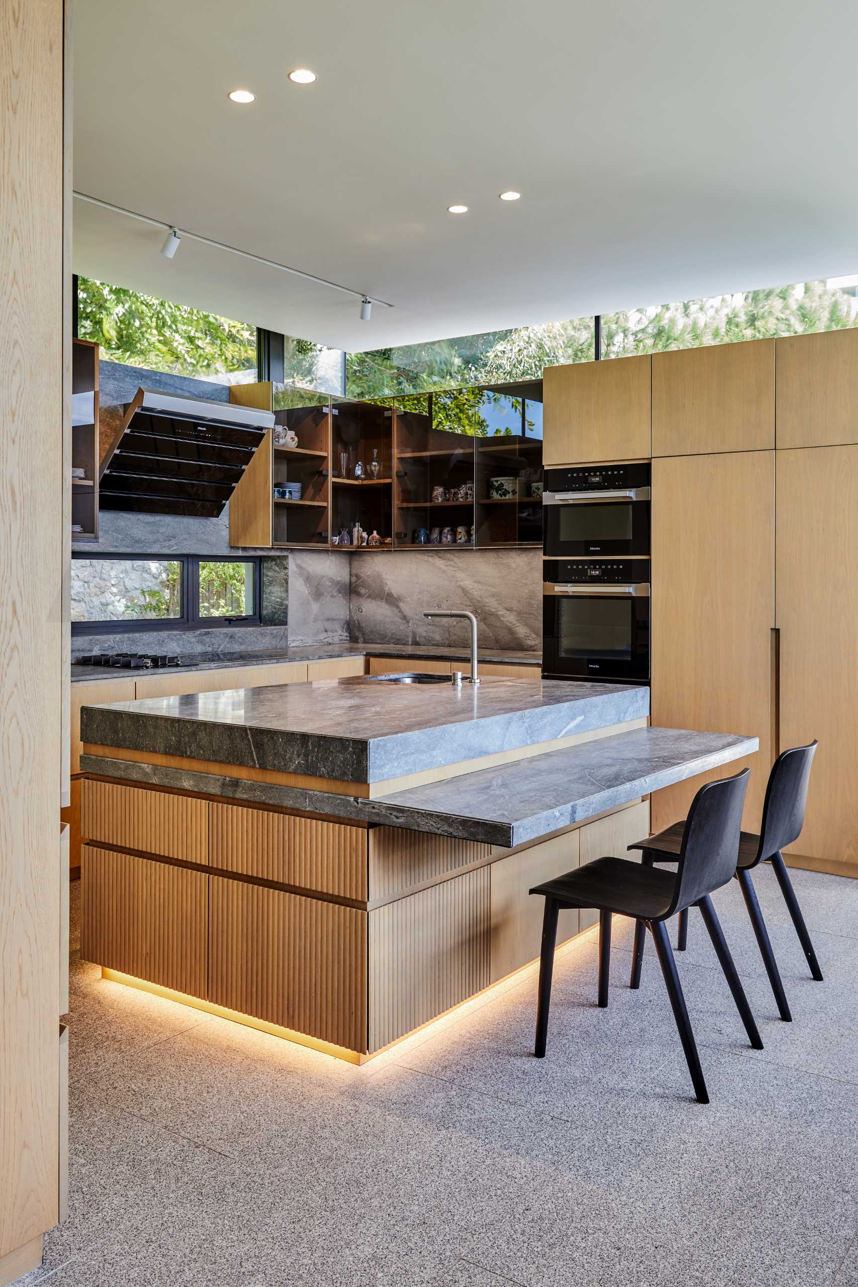 A modern kitchen with clerestory windows.