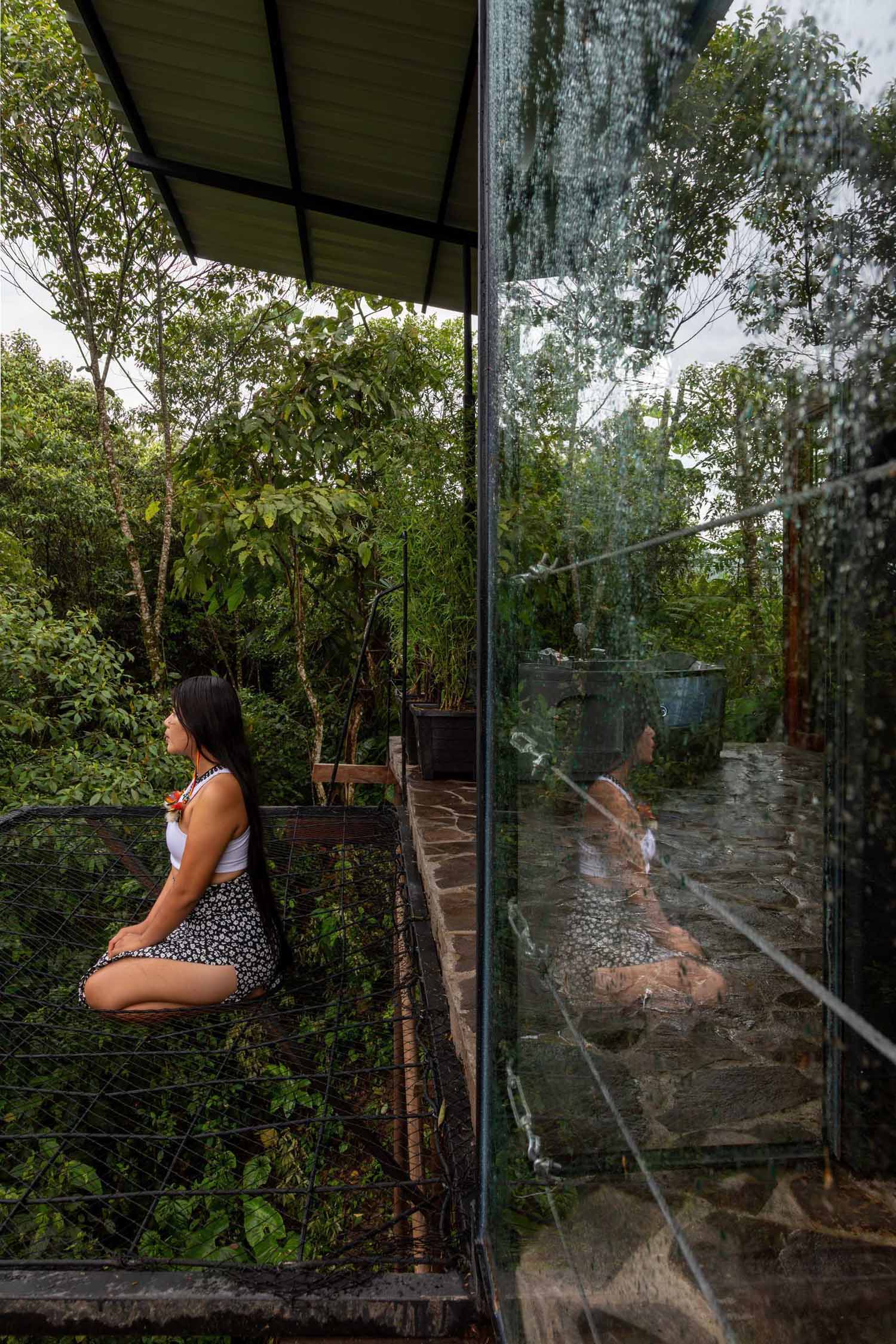 A room in the jungle includes a sleeping area, bathroom, and a balcony.