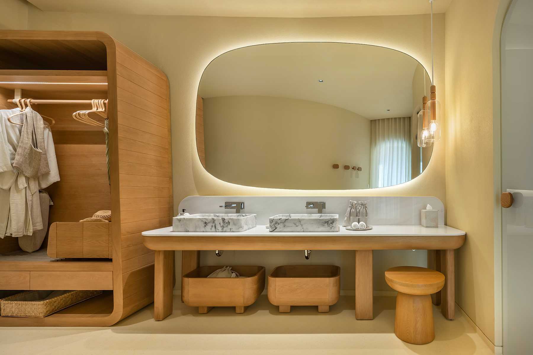 A modern bathroom with earth tones and natural materials.