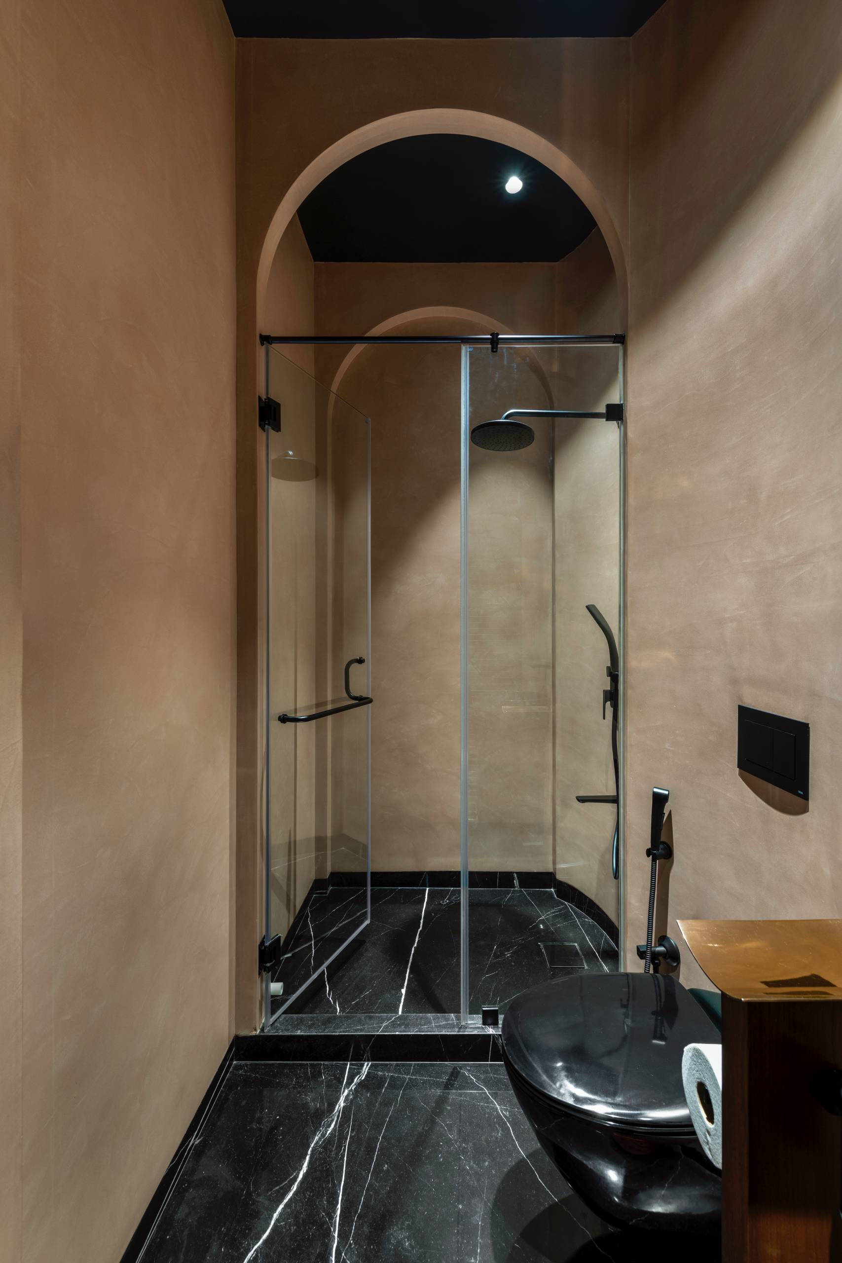 A modern bathroom with arches.