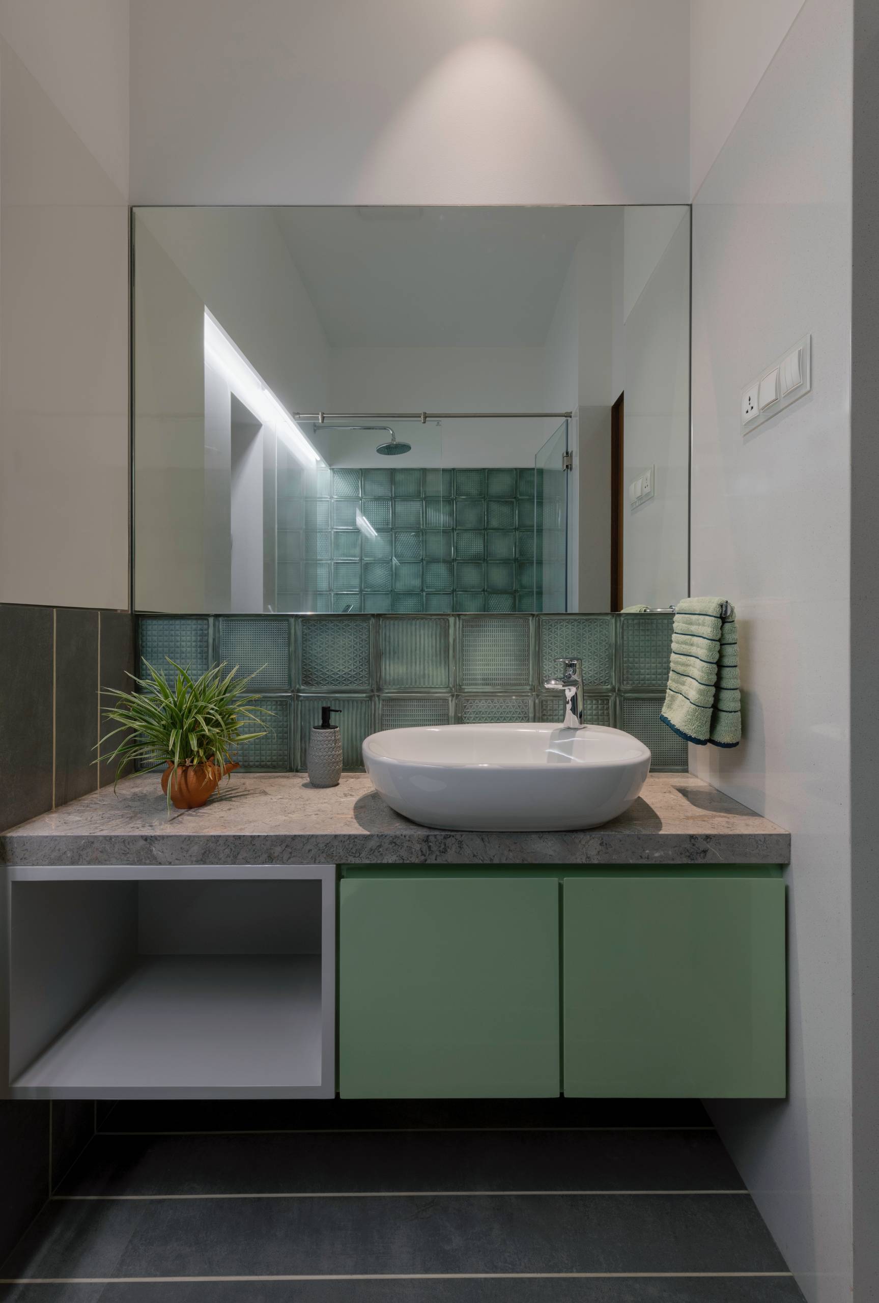 A modern bathroom with glass blocks.