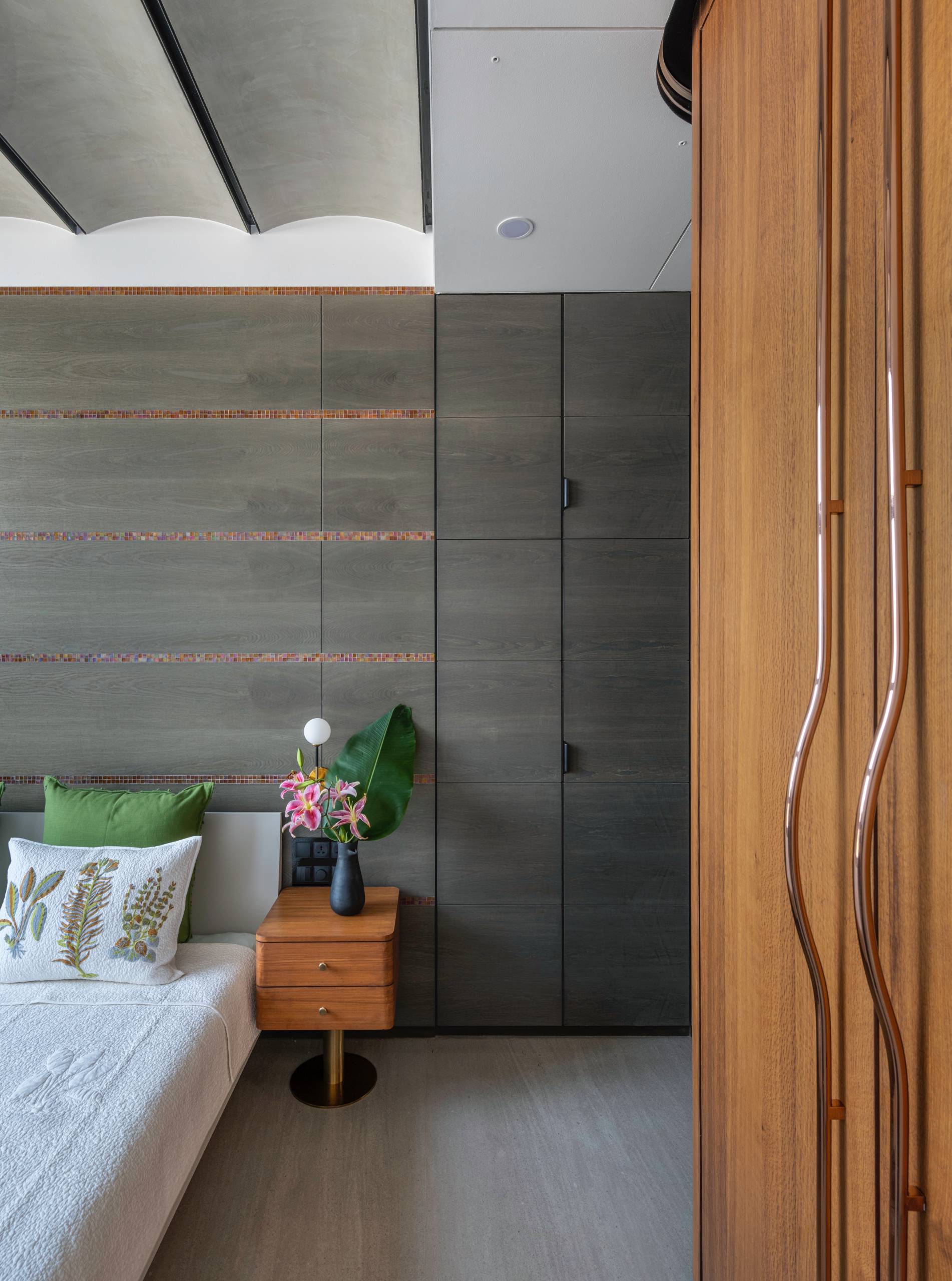 A modern bedroom with wood accents.