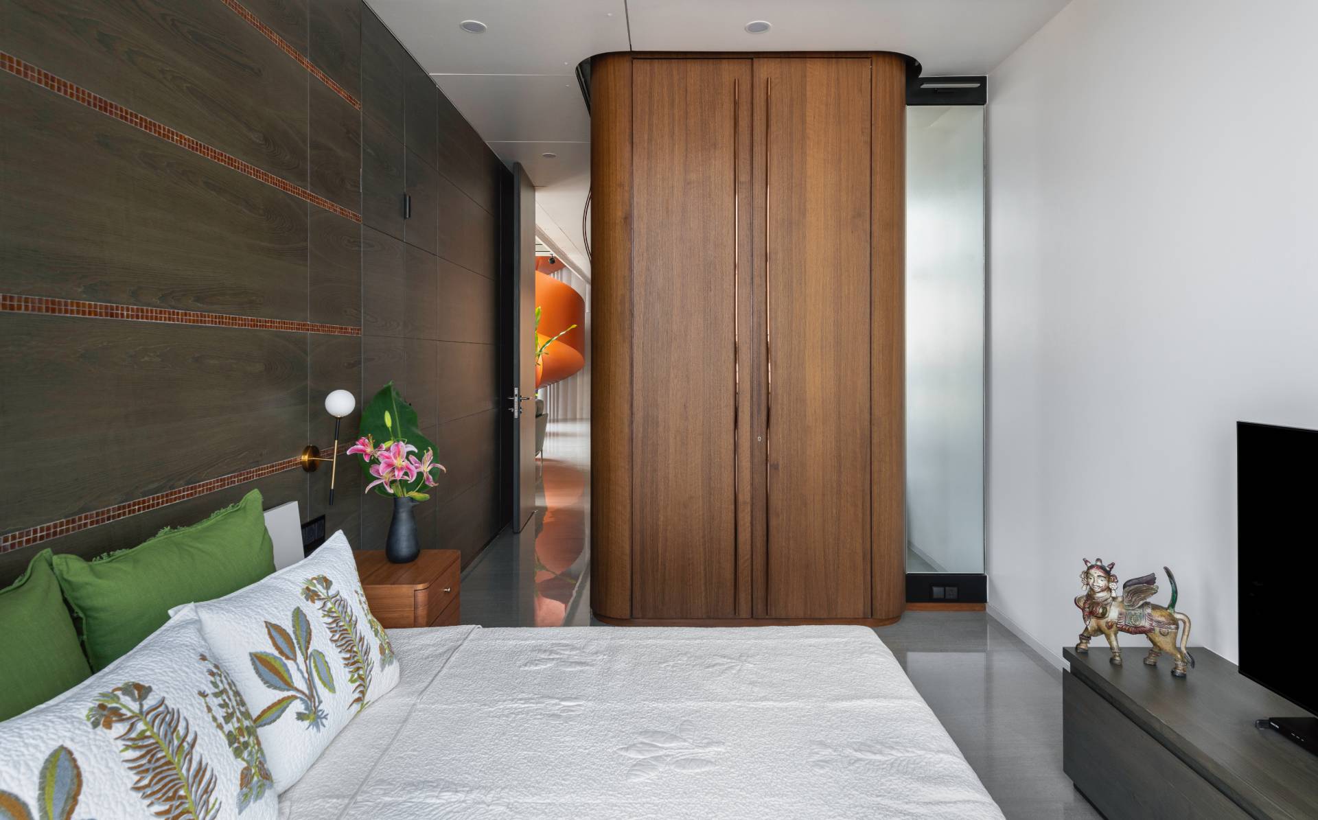 A modern bedroom with wood accents.