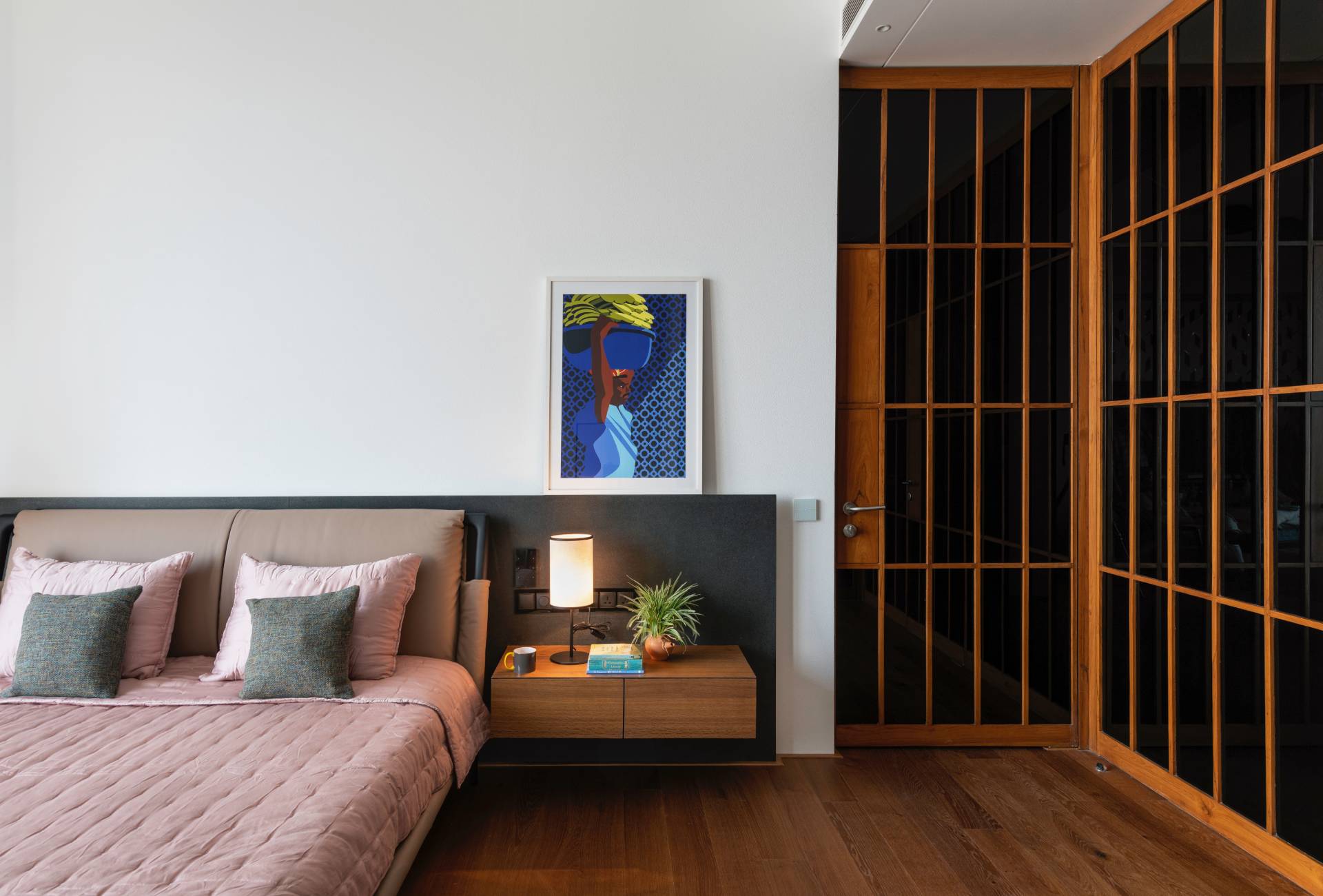 A modern bedroom with wood accents.