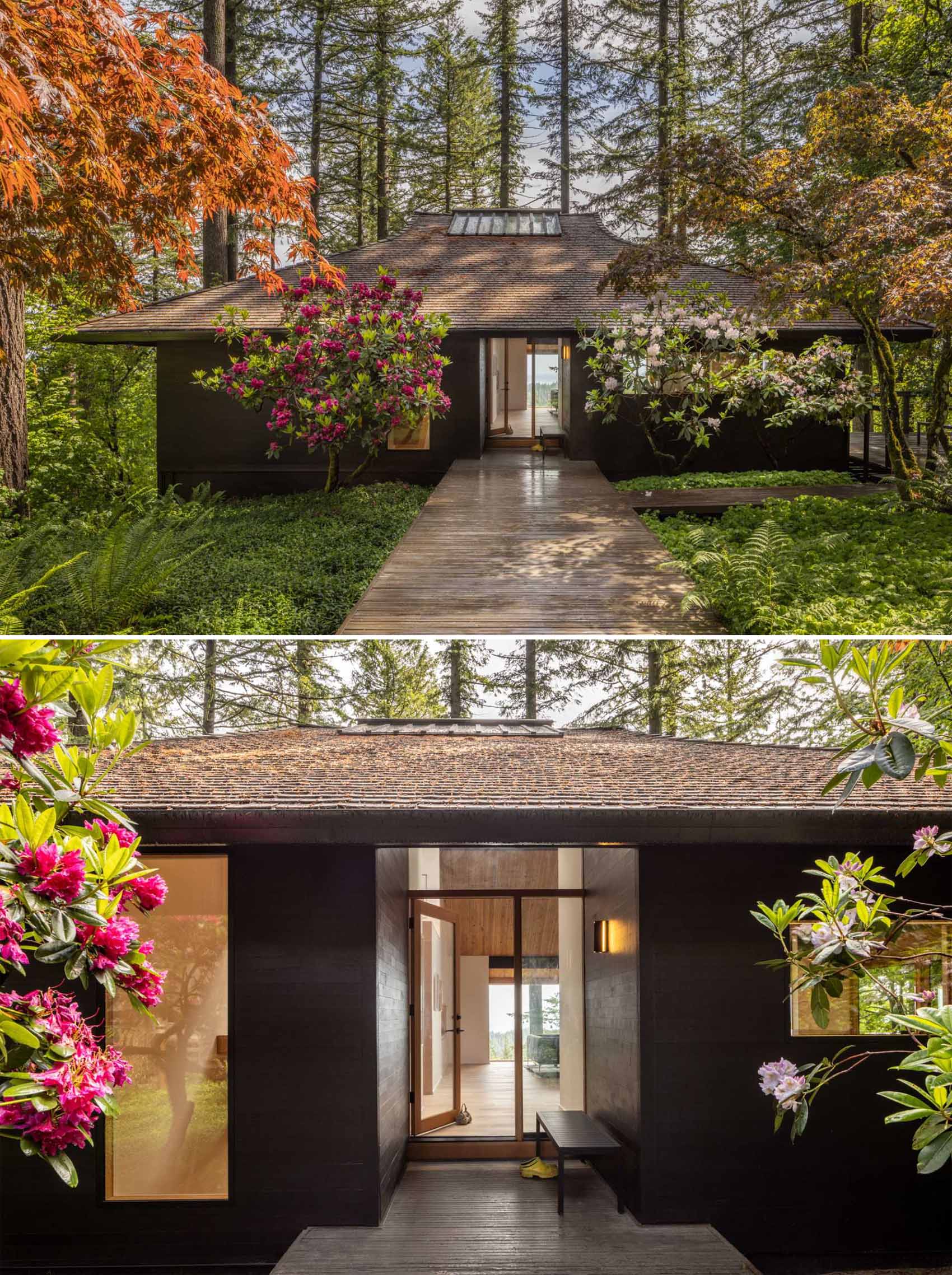 This updated mid-century modern home features an exterior of dark stained wood, new windows, and a wide path leading to the front door.