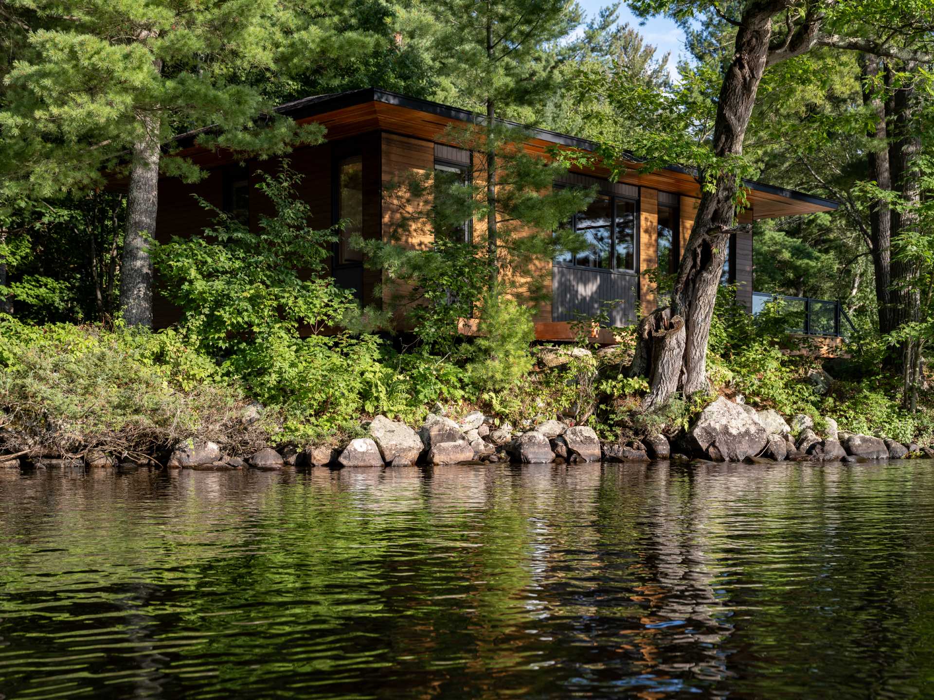 A small Canadian lakefront cabin with exposed Douglas Fir posts and beams.