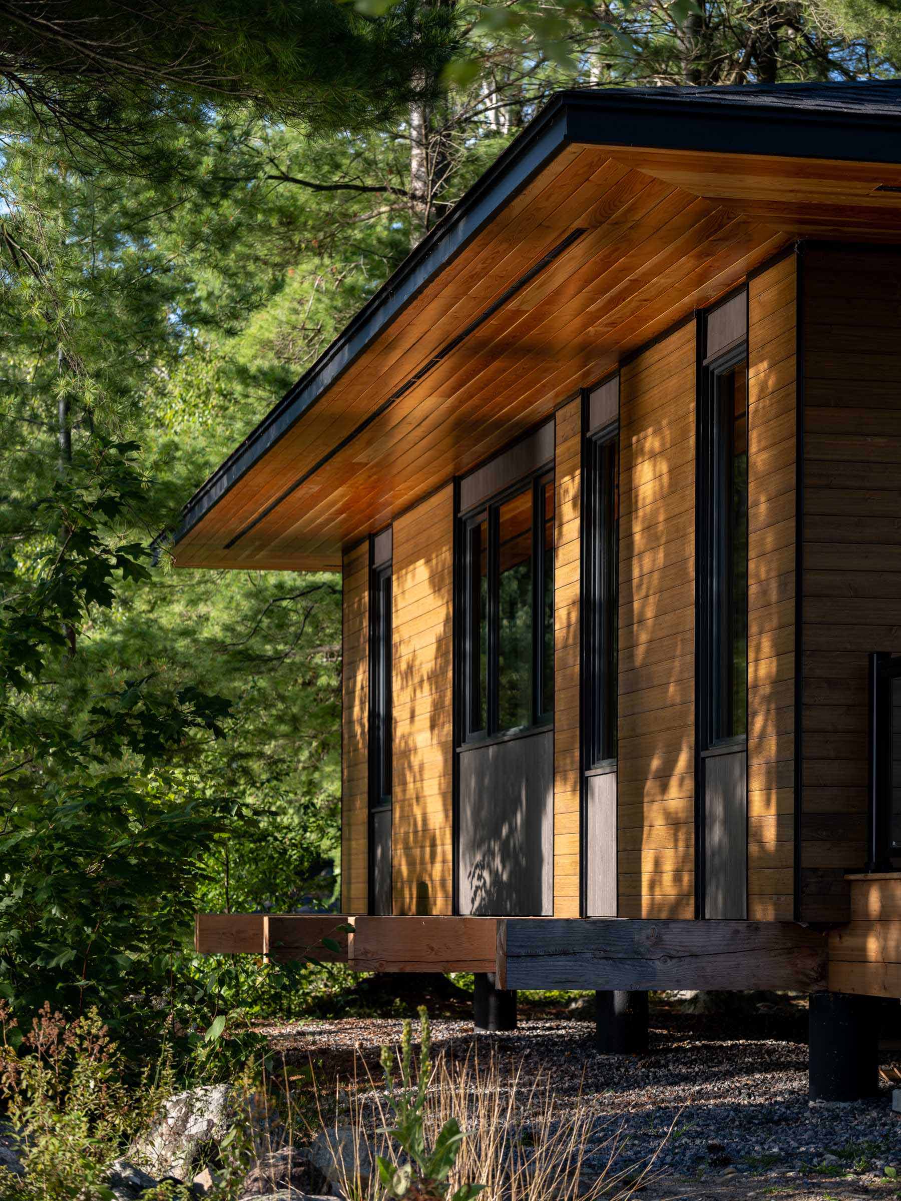 A small Canadian lakefront cabin with exposed Douglas Fir posts and beams.