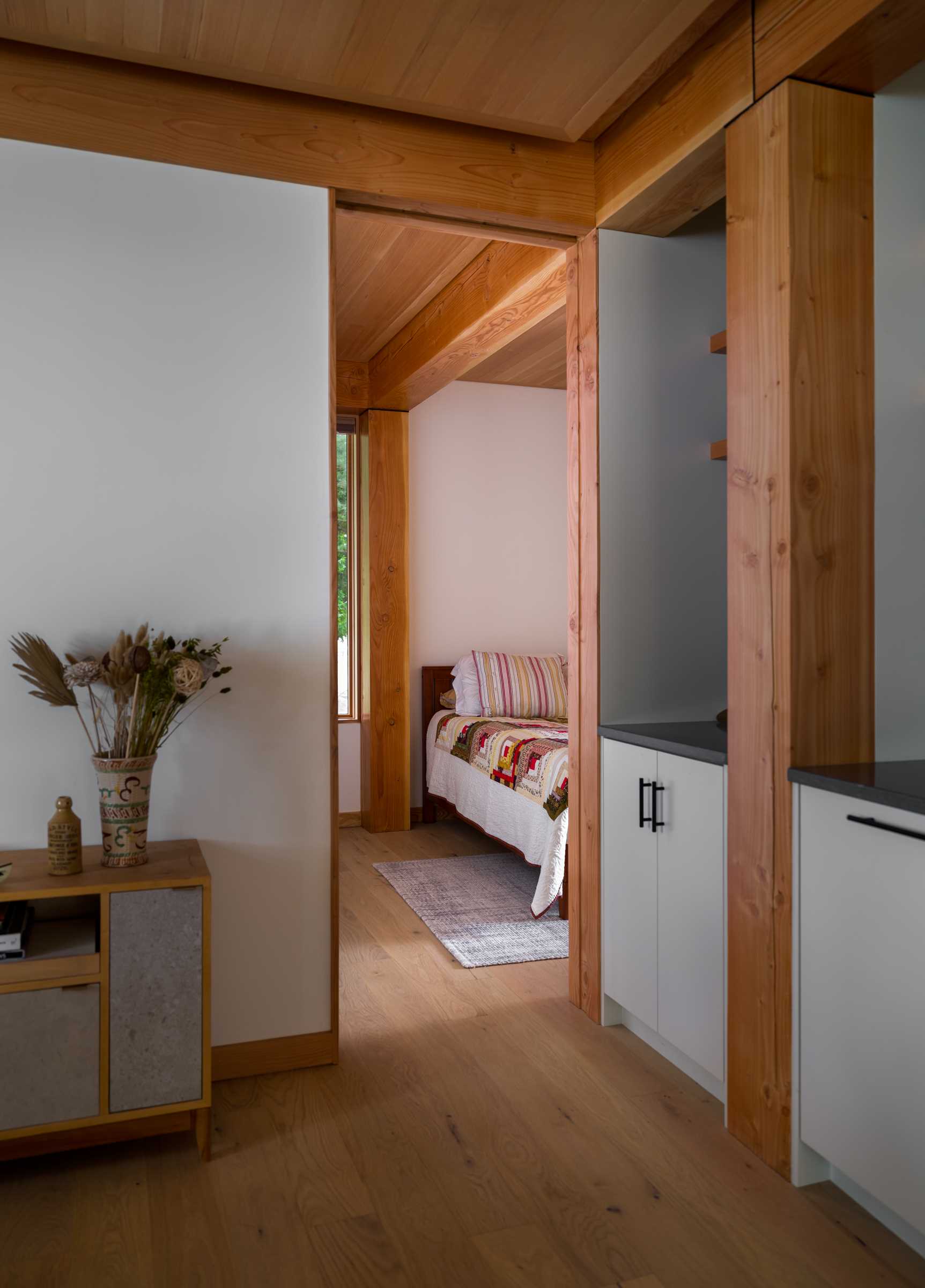 The contemporary bedroom in a small lakefront cabin.