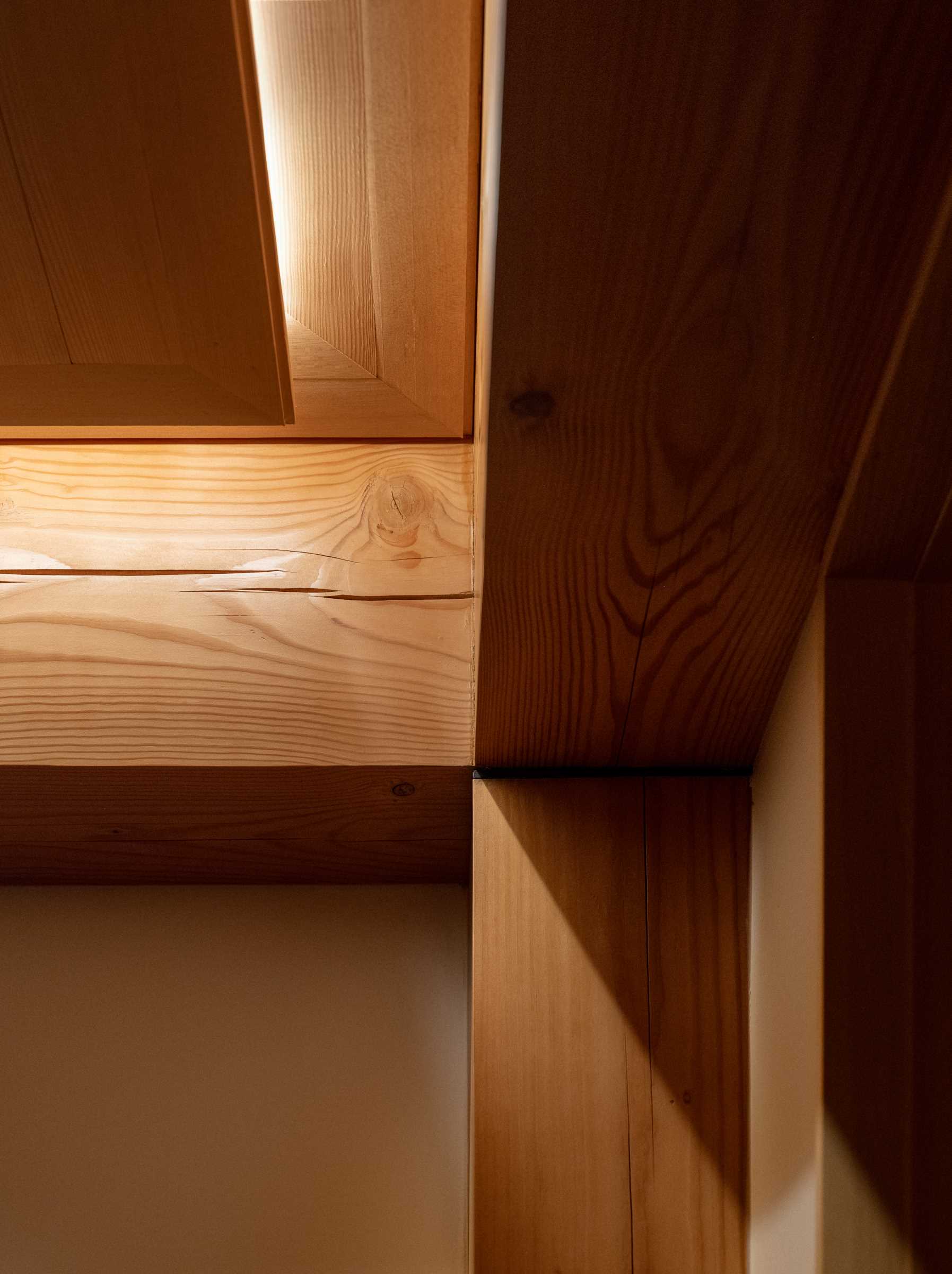 Douglas fir posts and beams in a small lakefront cabin.