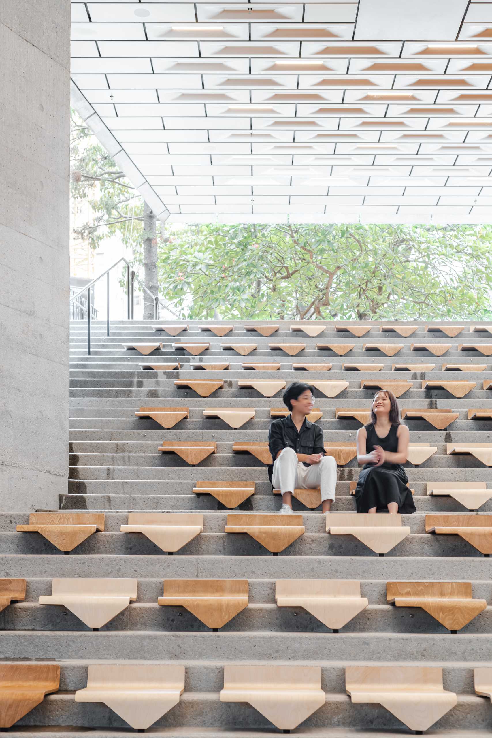 A collection of modular chairs for stairs that can be easily moved and stacked.