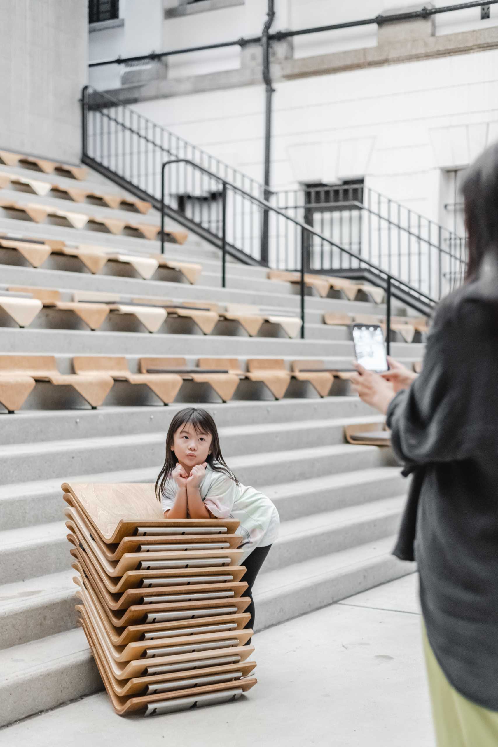 A collection of modular chairs for stairs that can be easily moved and stacked.