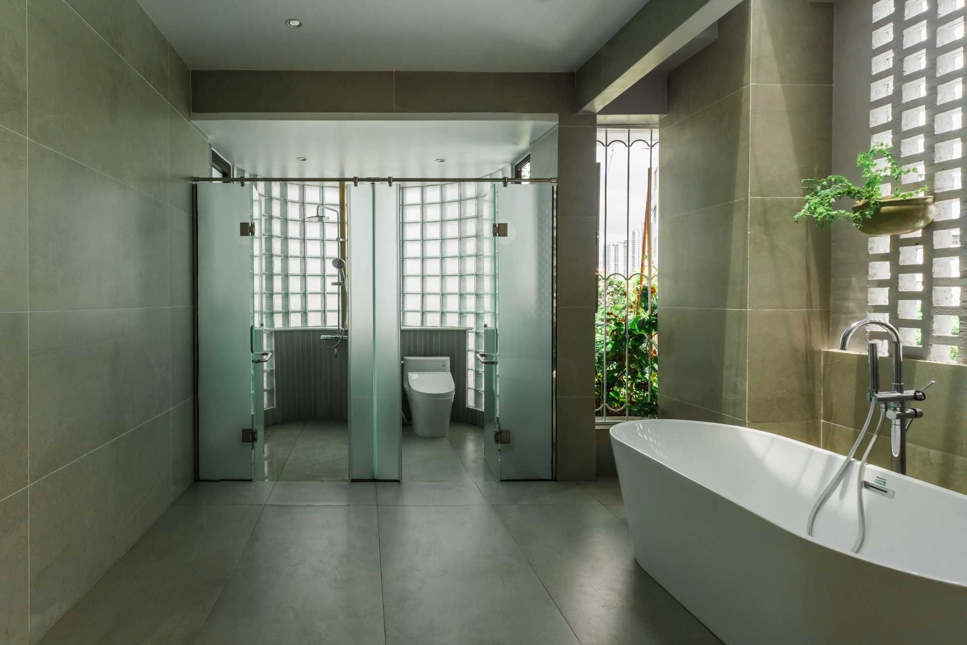 A contemporary bathroom in a villa in Vietnam.