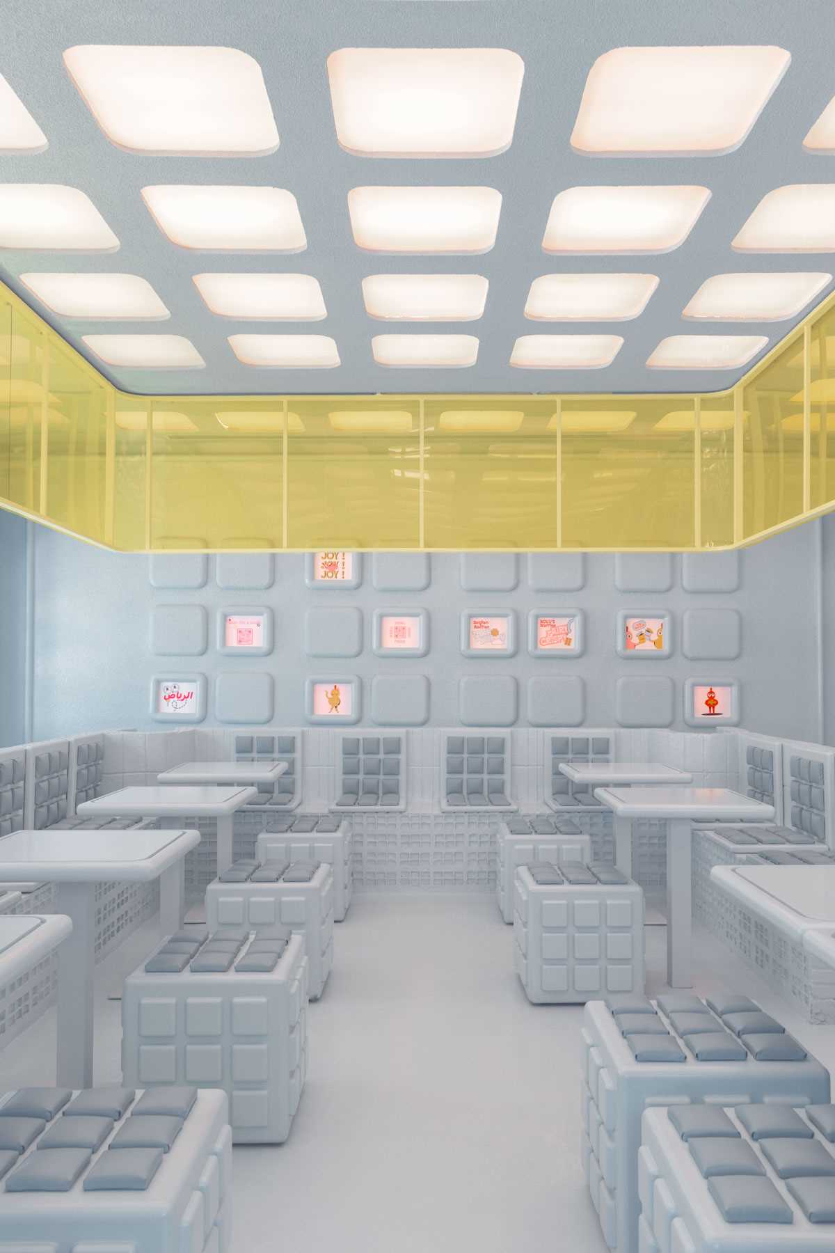 A modern restaurant interior design inspired by the shapes found in a waffle.