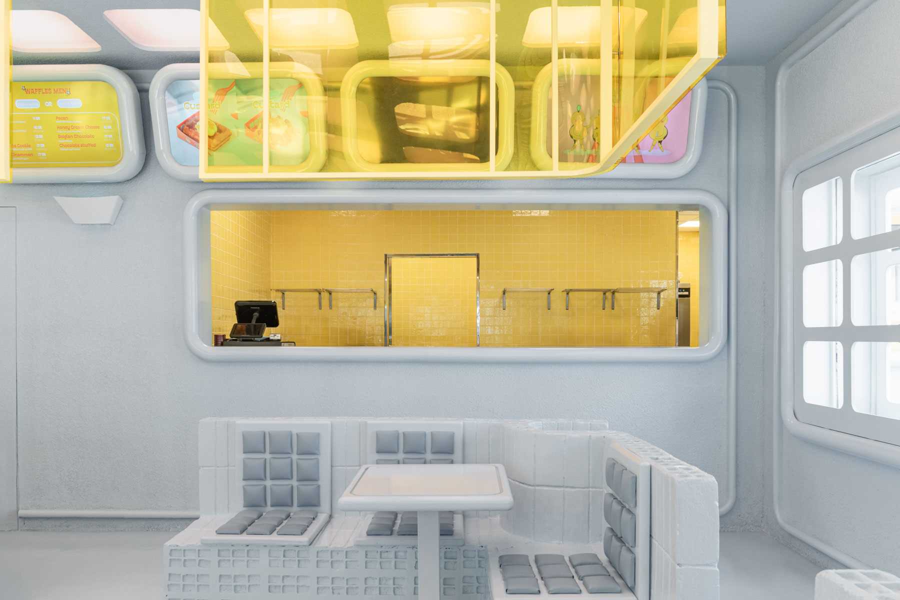 A modern restaurant interior design inspired by the shapes found in a waffle.