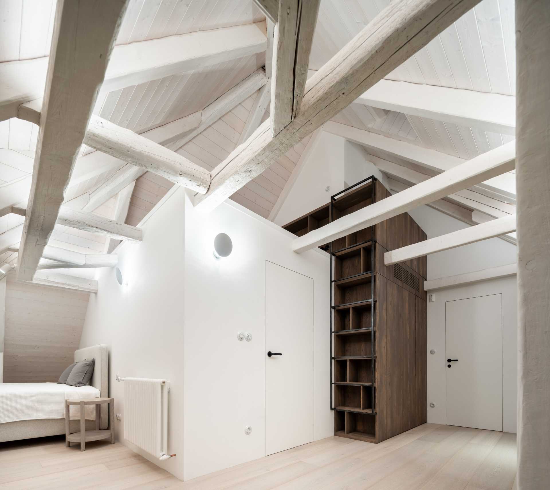 An attic has been transformed into a bedroom suite.