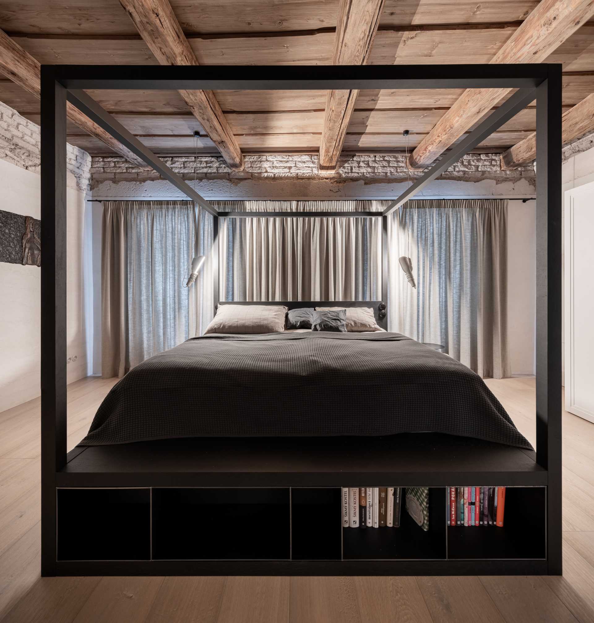 In this bedroom, the designers illuminated wood ceilings indirectly, creating a very pleasant lighting effect in the bedrooms. They also left the plaster "untightened" with exposed brickwork under the ceilings.