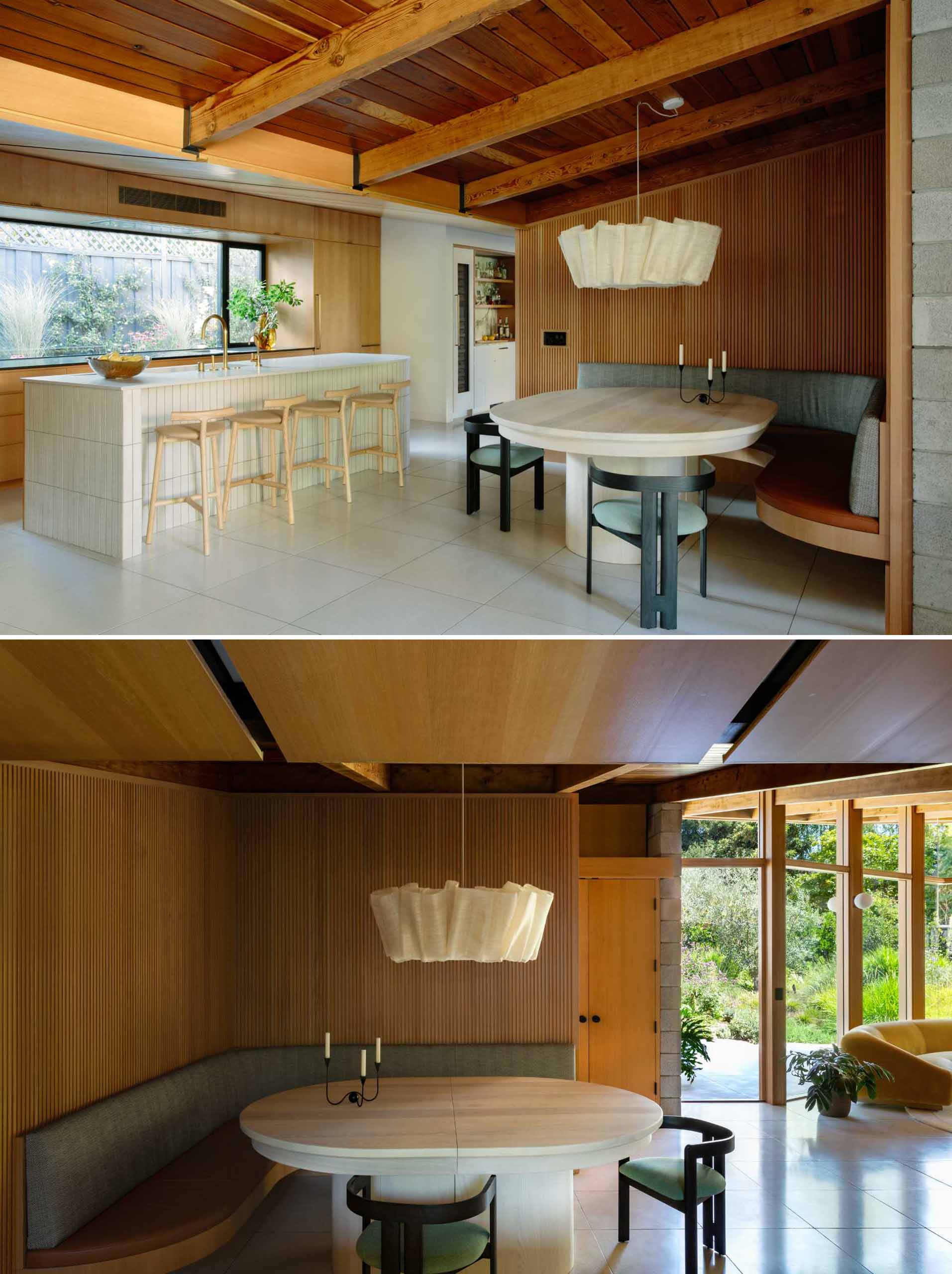 A renovated mid-century modern home has a new kitchen and a corner banquette dining area.