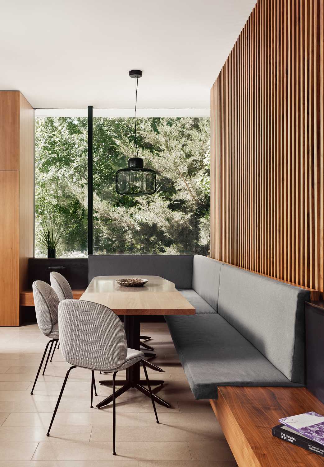 A modern kitchen and breakfast room, with built-in banquette seating.