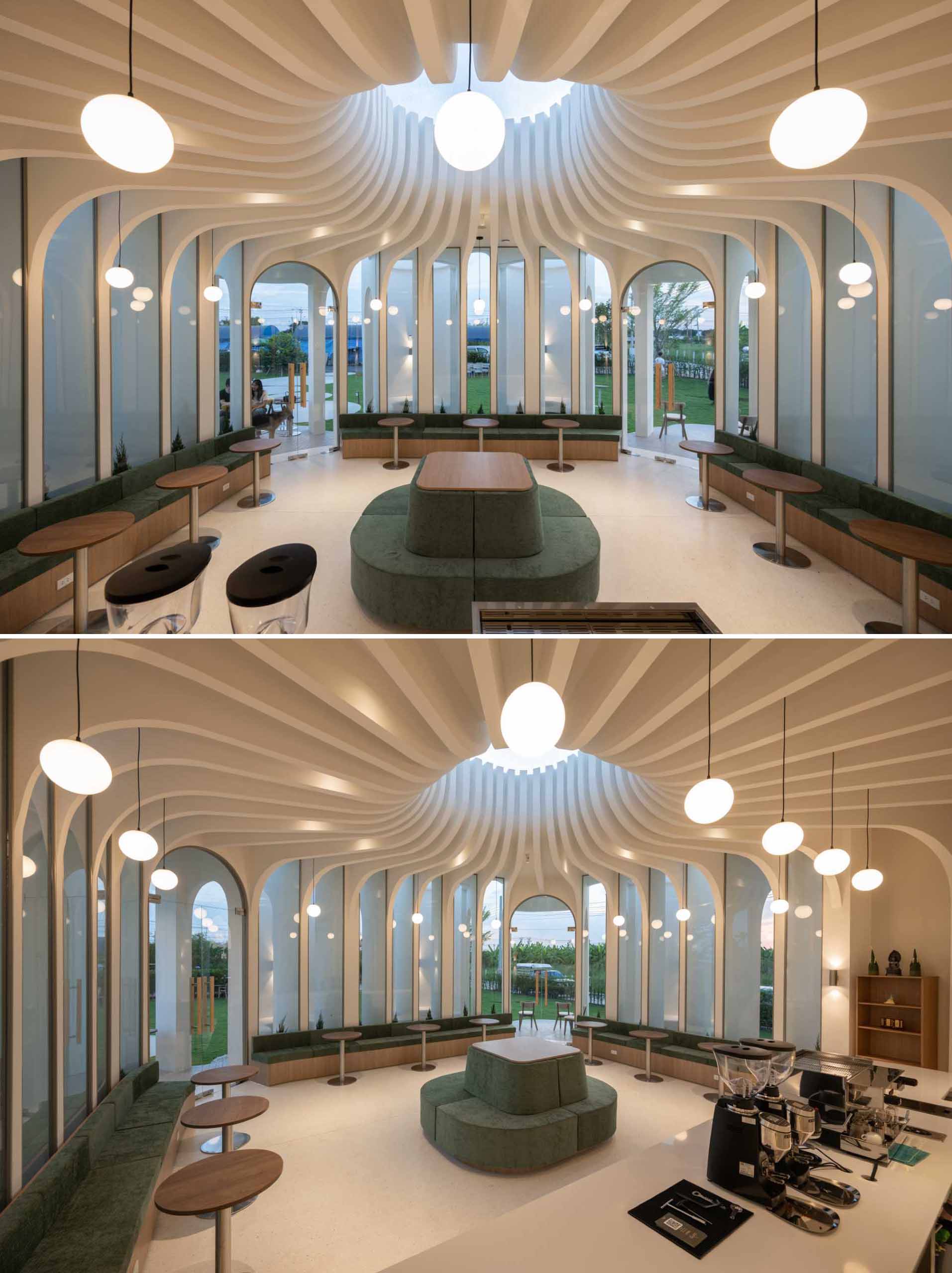 The structure of this modern cafe is on display with the vertical lines gathering at a central point where a skylight provides a glimpse of the sky.