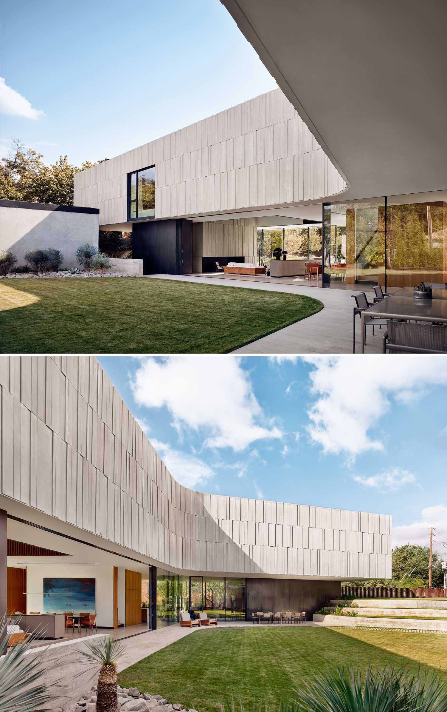 A modern home with a curved design and 40ft long wall of sliding glass doors.