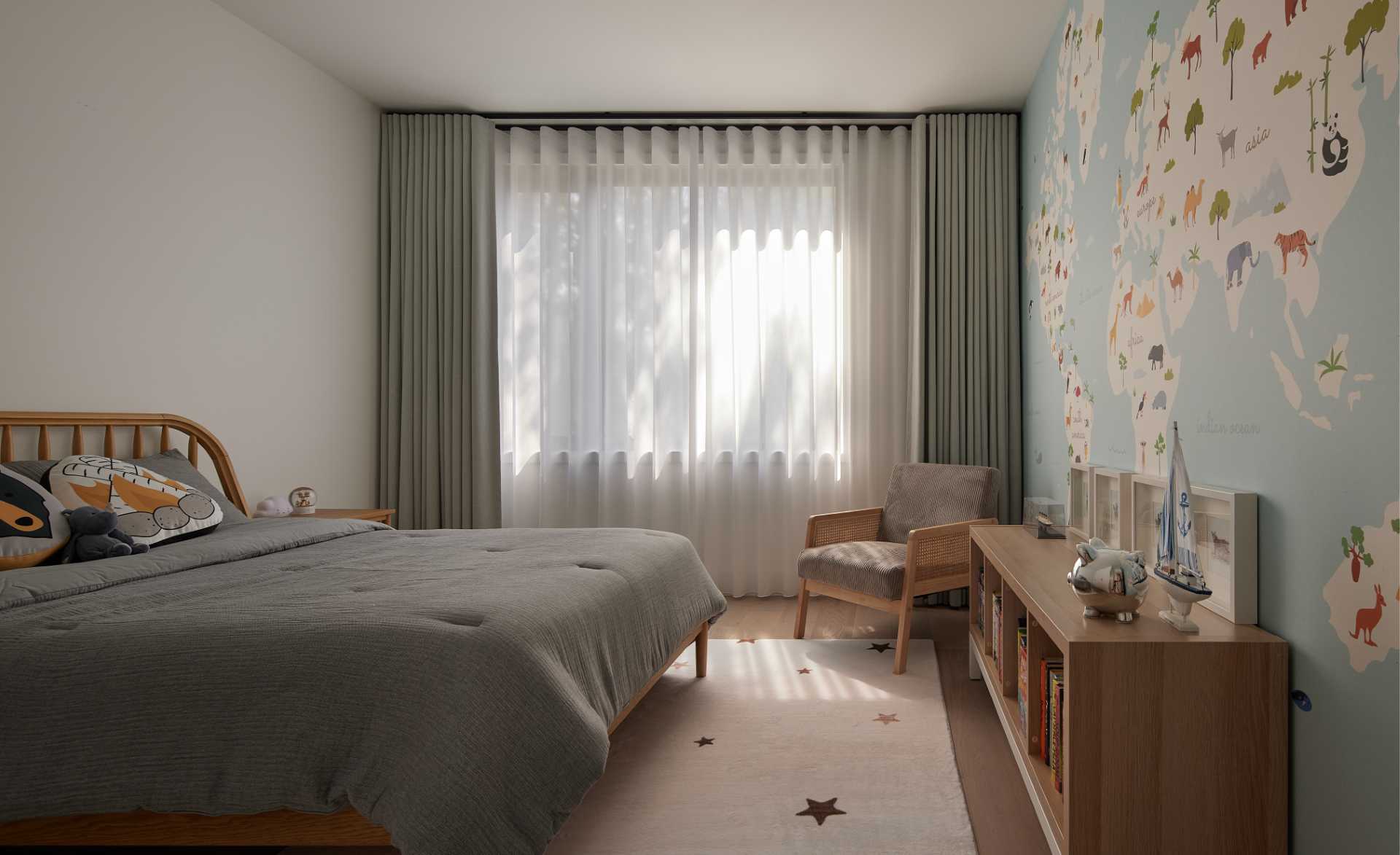 In a child's bedroom, a world map covers the wall and adds color to the interior.