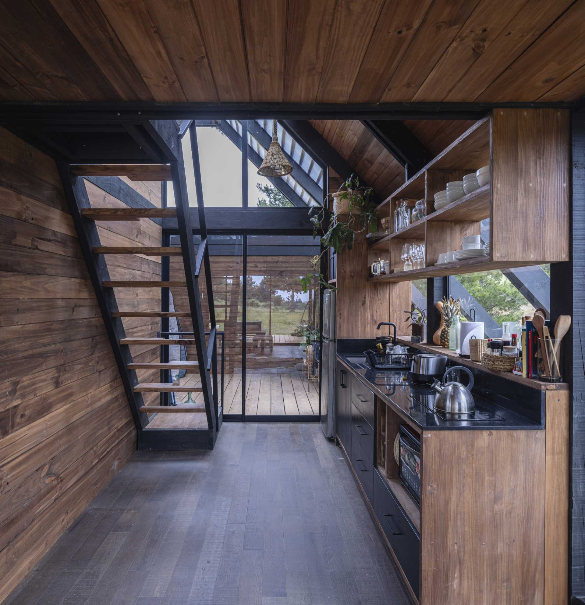 The kitchen of a small wedge-shaped home.