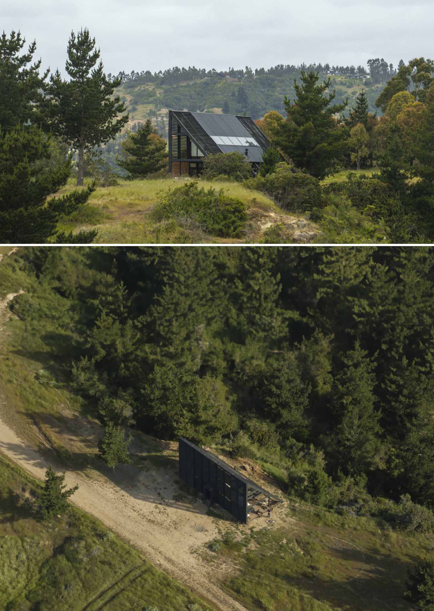 A small wedge-shaped home with a black exterior that's located on the windy beach of Matanzas, Chile.