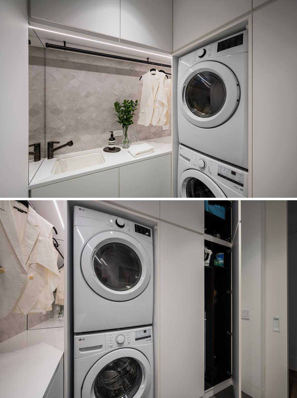 A modern laundry room with stretched-hex porcelain tile, plenty of storage, hidden lighting, and a fold-out table.