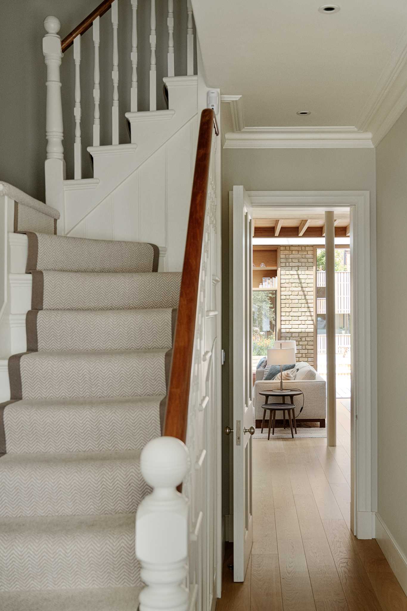 A hallway connects the original areas of the home with the new rear addition.