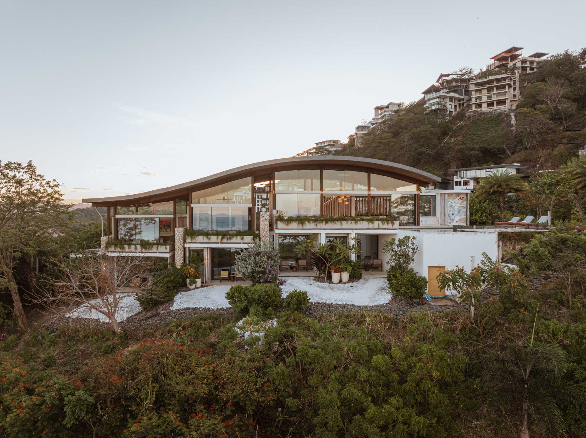 A modern house design with a curved roof.