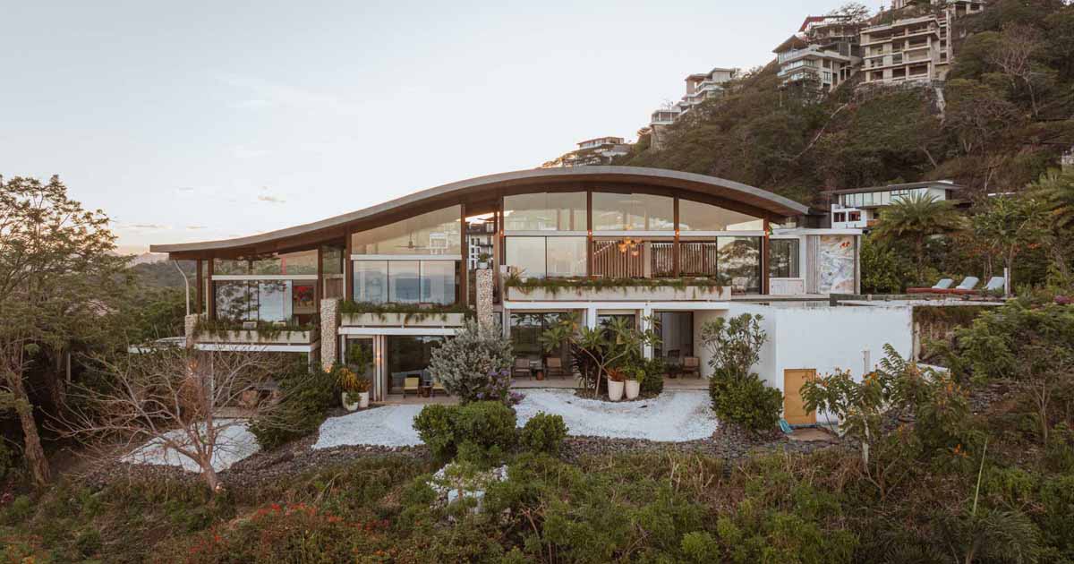 A Home With A Curved Roof Inspired By The Land Around It