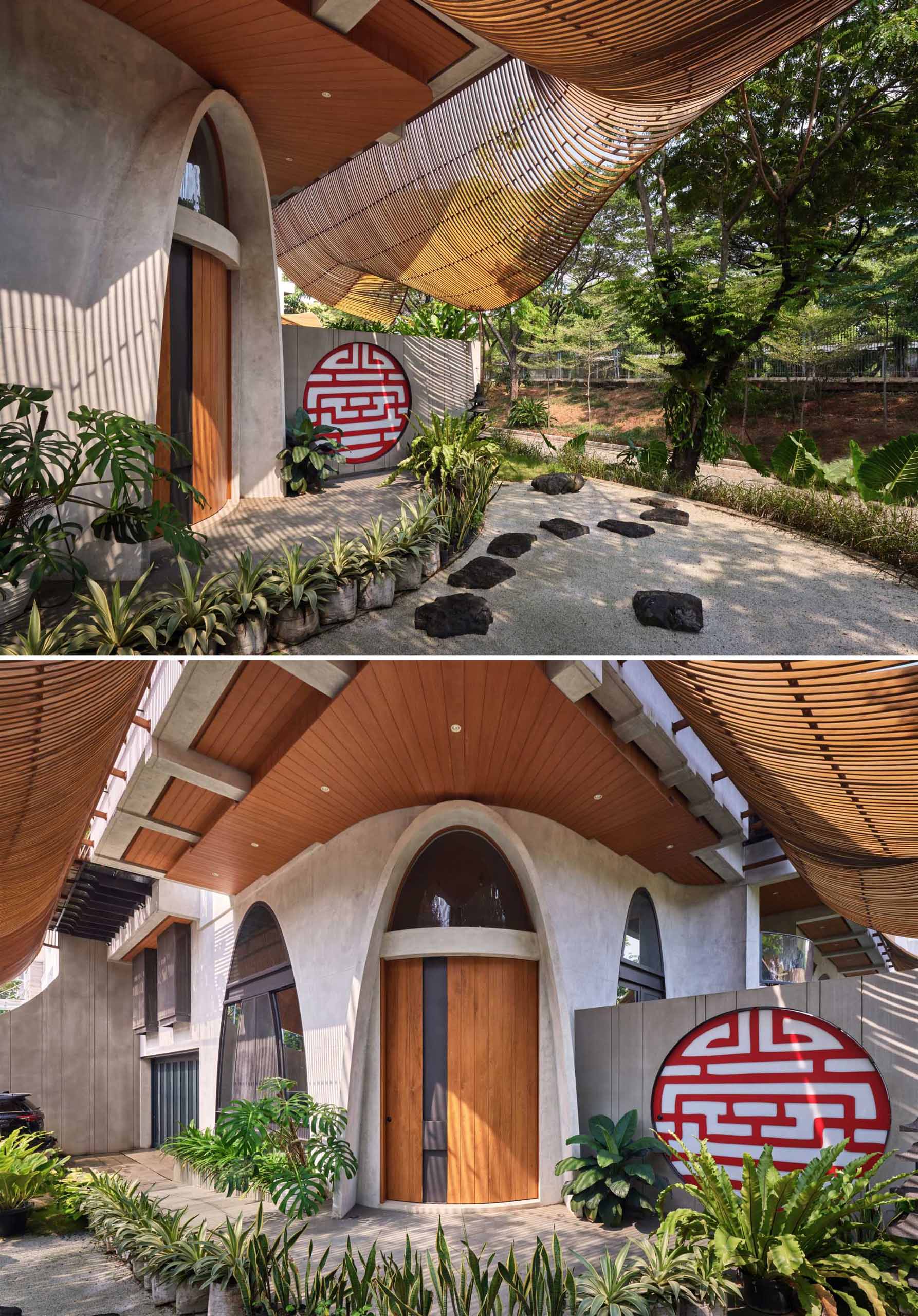 The shaded entryway of this home home includes a circular opening that provides a glimpse of the pool on the other side of the wall.