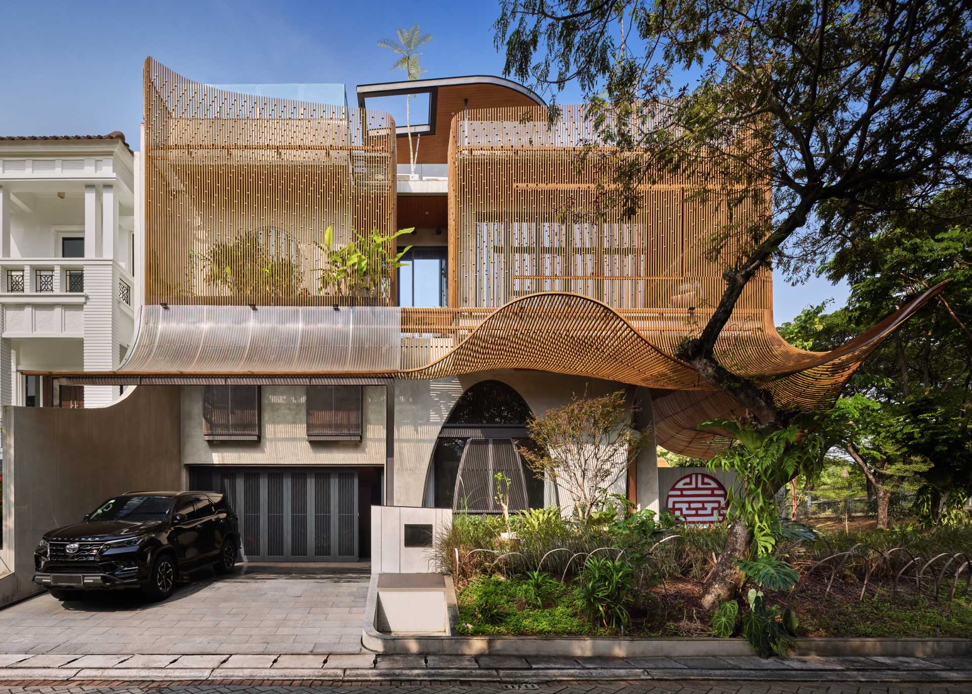 A modern home with operable steel fins on its exterior facade.