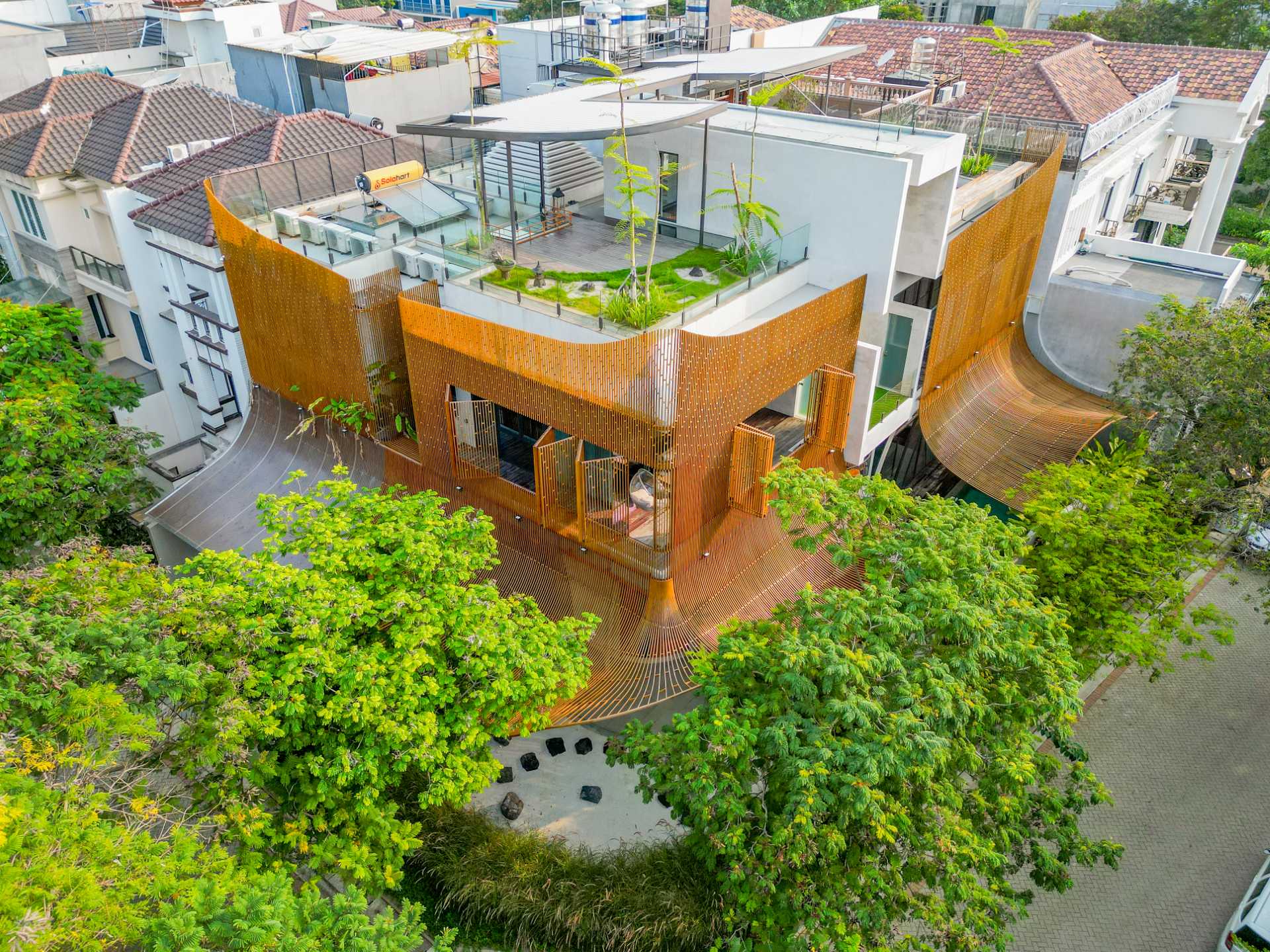 A modern home with operable steel fins on its exterior facade.