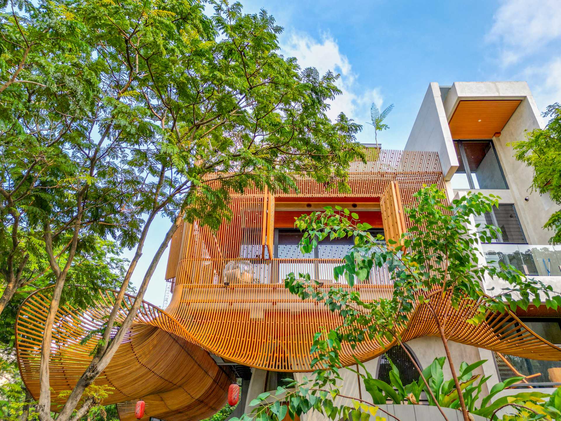 A modern home with operable steel fins on its exterior facade.