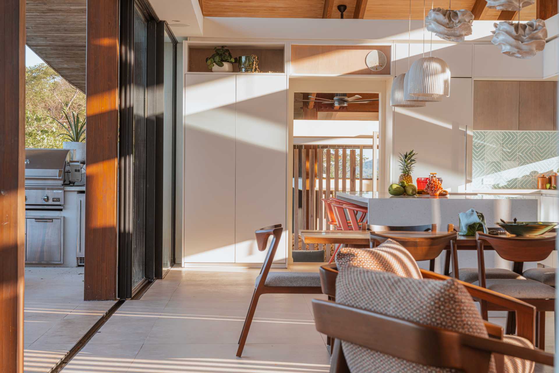 A modern white kitchen in an open plan interior.