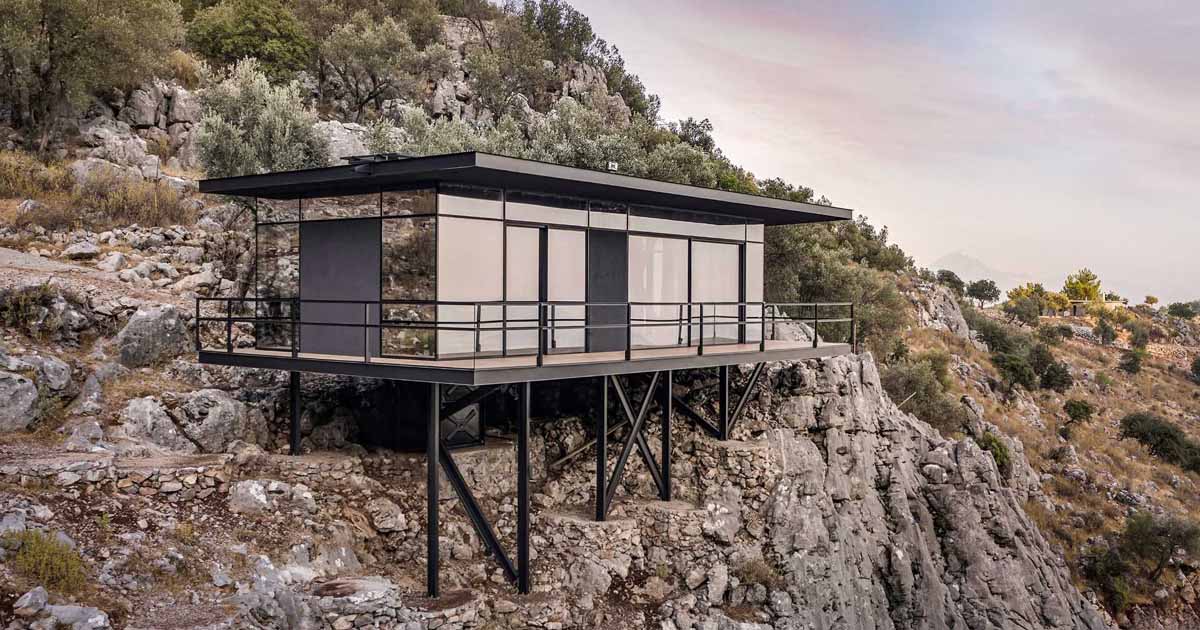 A Modern Cabin Perched On The Edge Of Rocky Cliffs